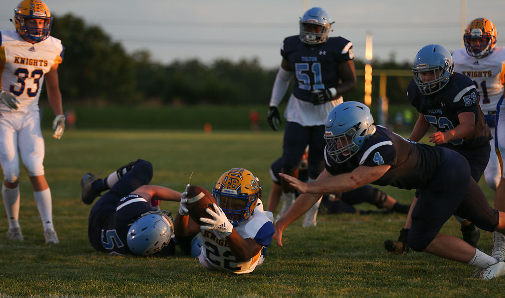 St. Francis Borgia running back Alonzo MacDonald stretches the ball out